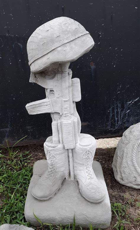 normal wear fallen soldier battlefield cross concrete statue