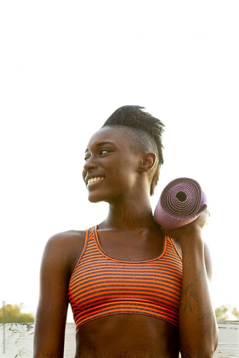 Portrait Of A Woman Standing With Yoga Mat By Stocksy Contributor