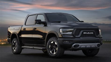 ram charges  unveils    pickup trucks