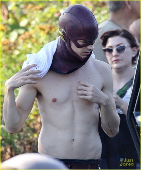 grant gustin suits up and strips down for the flash filming in