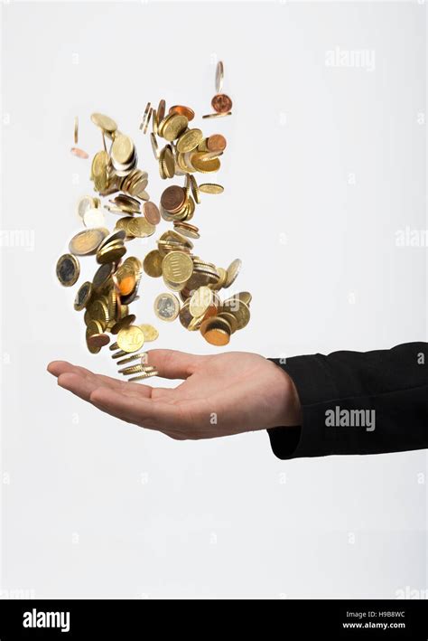 hand throwing coins stock photo alamy