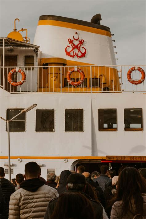people boarding  ship  stock photo
