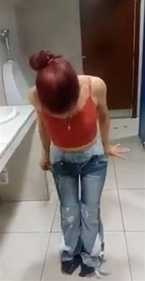 shoplifter takes off nine pairs of jeans after being caught on camera