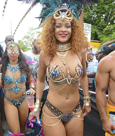 rihanna wears a jewelled bra and head dress at the kadooment day parade