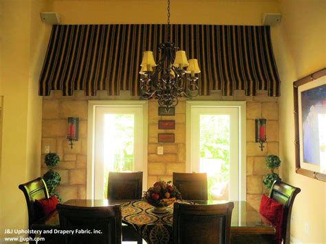 dining room table   chairs   chandelier hanging   ceiling