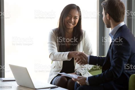businessman handshake smiling asian client closing business deal stock