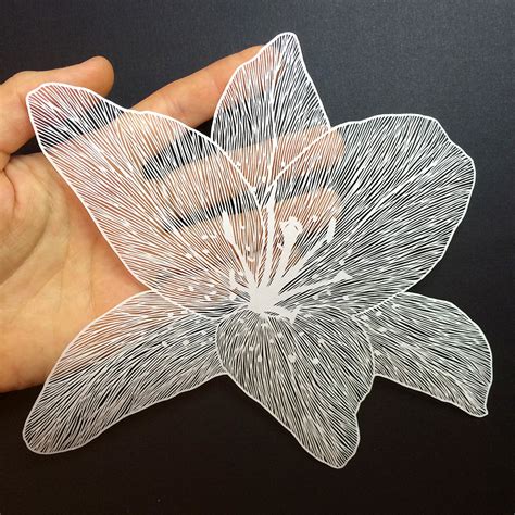 maude white creates delicate paper cut flowers