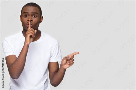 African American Man Holding Finger On Lip Mouth Keep It Quiet Hush