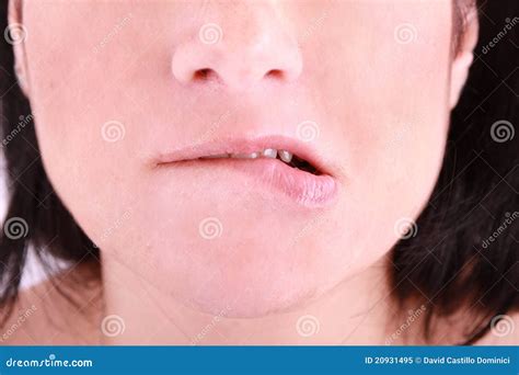 embarrassed woman biting   lip royalty  stock photo image