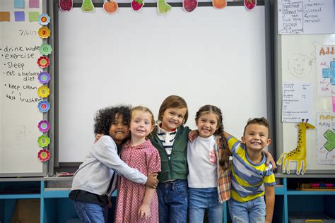 group  diverse kindergarten students standing  hopping