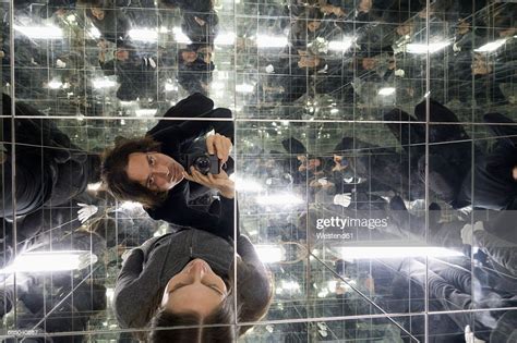 Couple Taking Selfies In A House Of Mirrors Photo Getty Images