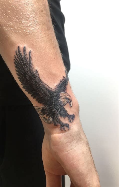 concept small eagle tattoo arm