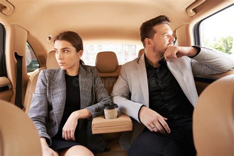 Man And Woman Sitting On Back Seats In Car Stock Image Image Of
