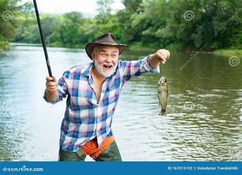 bearded man catching fish male hobby   background   water   reflection