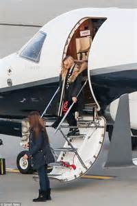 make up free madonna lands at zurich airport by private jet in her slippers following her moving