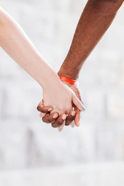 Free Photo Close Up Of Interracial Couple Holding Hands