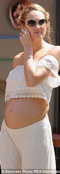 Candice Swanepoel Puts Her Bare Bump On Display In Crop