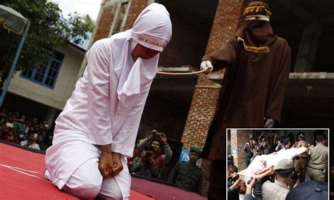 indonesian woman sobs as she is caned in public for having sex outside marriage daily mail online