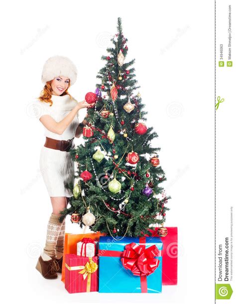 A Happy Woman Posing Near The Christmas Tree Stock Image