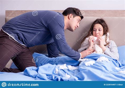 wife caring for sick husband at home in bed stock image image of