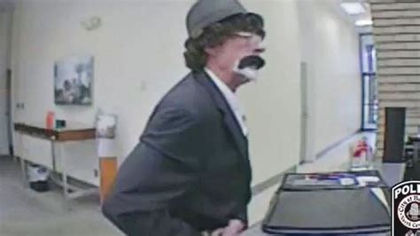 surveillance video captures north carolina bank robber in unique