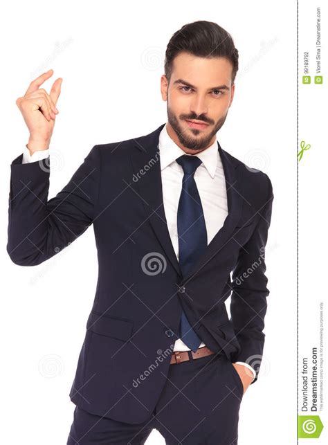 smiling young business man snapping  fingers stock photo image