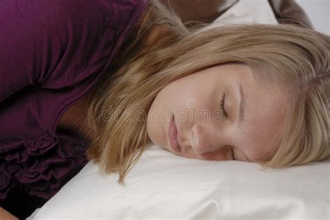 Teenage Girl Sleeping On Pillow On Sofa Stock Image