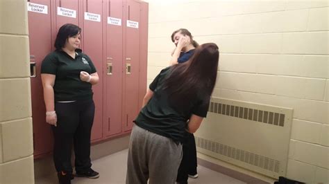girl being strip searched in jail