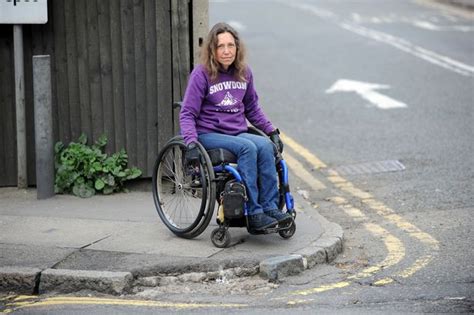 Woman Thrown From Wheelchair After Hitting Pothole In Guildford