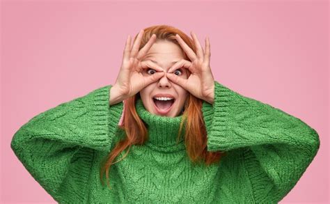 Premium Photo Playful Redhead Girl Making Mask With Fingers