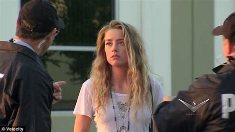 amber heard flips off cops as she gets pranked by johnny depp daily