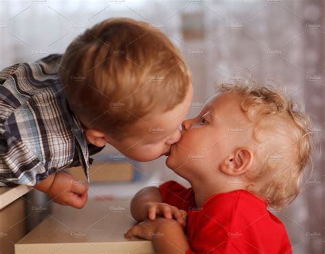 two little brothers are kissing containing brother kissing and kiss