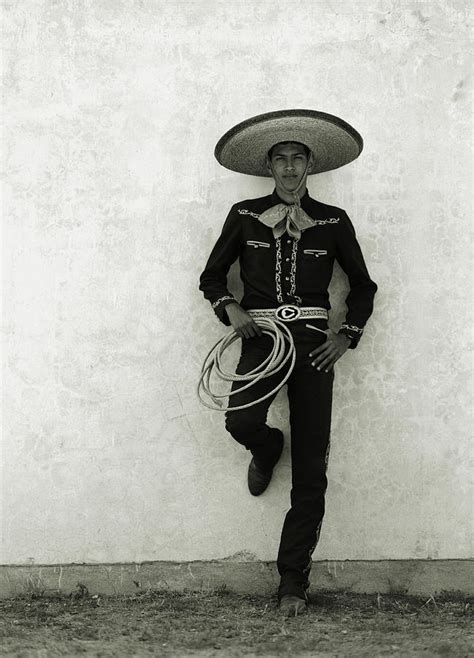mexican cowboy wearing hat  holding photograph  terry vine pixels