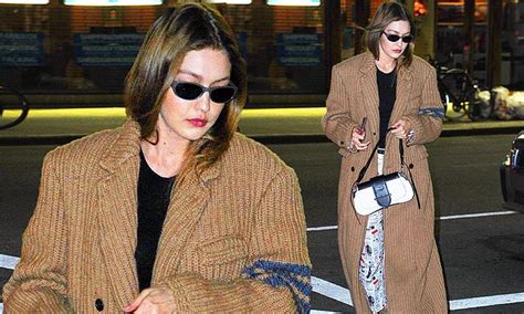 gigi hadid sports shades as she steps out in nyc in brown knit coat and