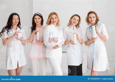 a group of happy beautiful female doctors nurses interns lab