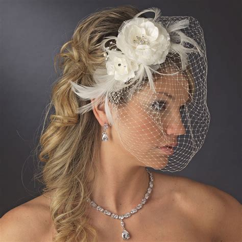 beautiful feather fascinator and birdcage face veil comb in white or