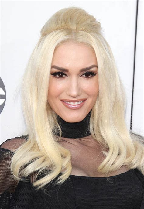 gwen stefani flashes knickers in see through skirt at american music