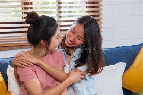happy asian lesbian couple hug each other with love on