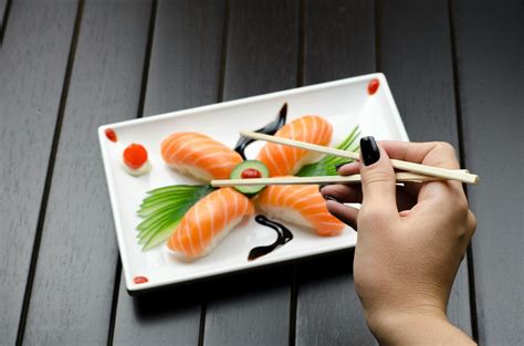 person eating sushi  stock photo