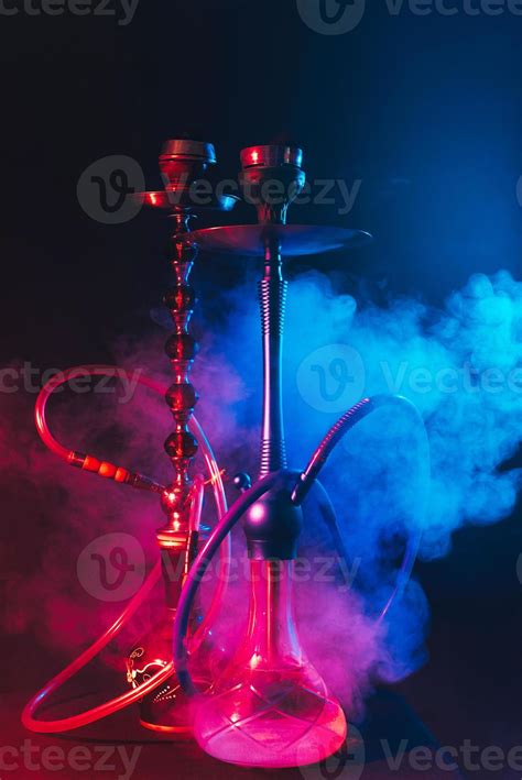 modern hookah shisha   smoky black background  neon lighting