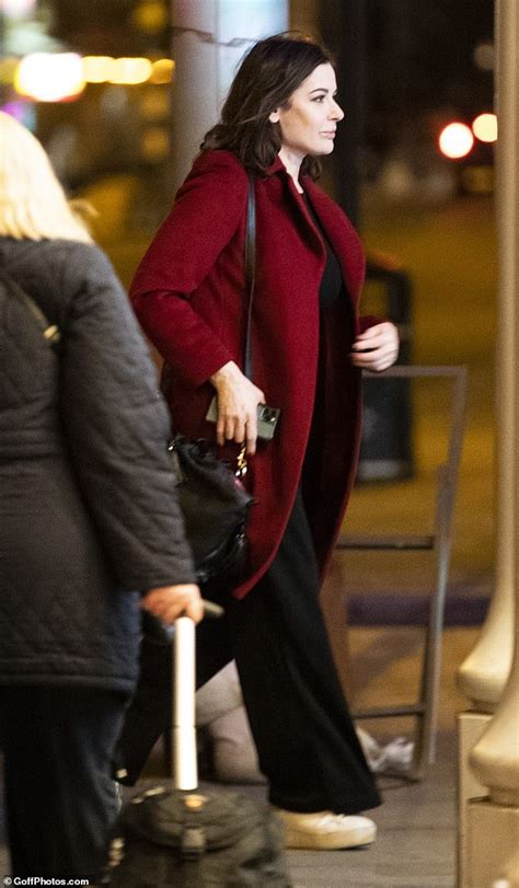 nigella lawson cuts a casual figure in a cosy red coat and trainers