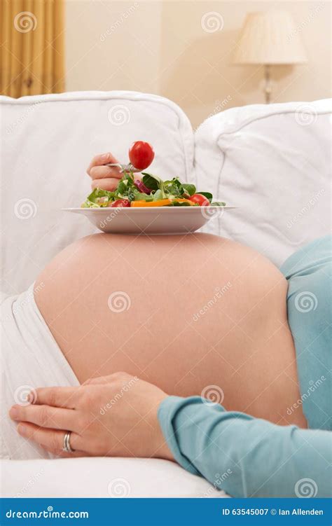 pregnant woman with healthy salad resting on belly stock image image