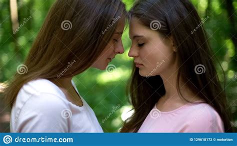 tender feelings of two beautiful lesbians affectionate attitude first