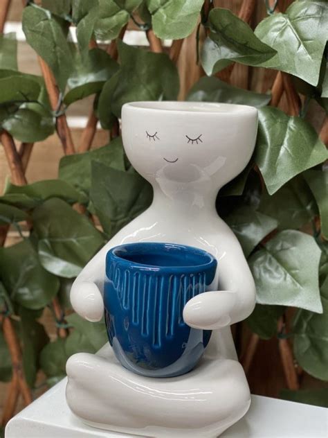 person holding pot sproutwell decor