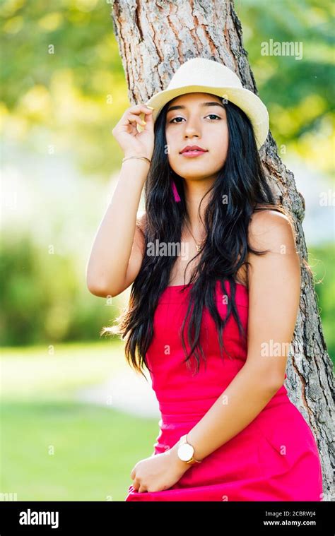 Young Brunette Latina Girl With Long Black Hair And Black Eyes Wearing