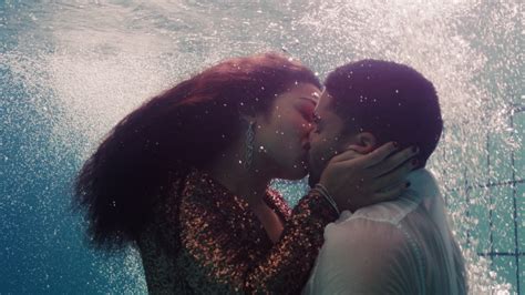 romantic couple kissing underwater in stock footage video
