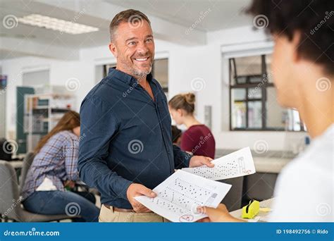 teacher giving test result  college student stock photo image