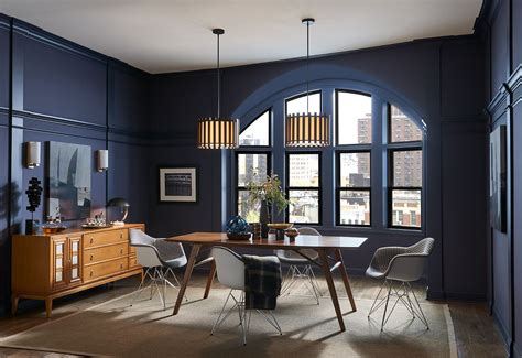 loft space dining room  arched window  dark blue walls sw