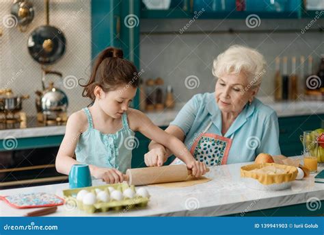 Granny Teaches Granddaughter To Bake Stock Image Image Of Dough