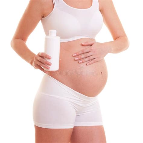 de zwangere vrouwenzitting  lotos stelt prenatale yoga motherhood stock afbeelding